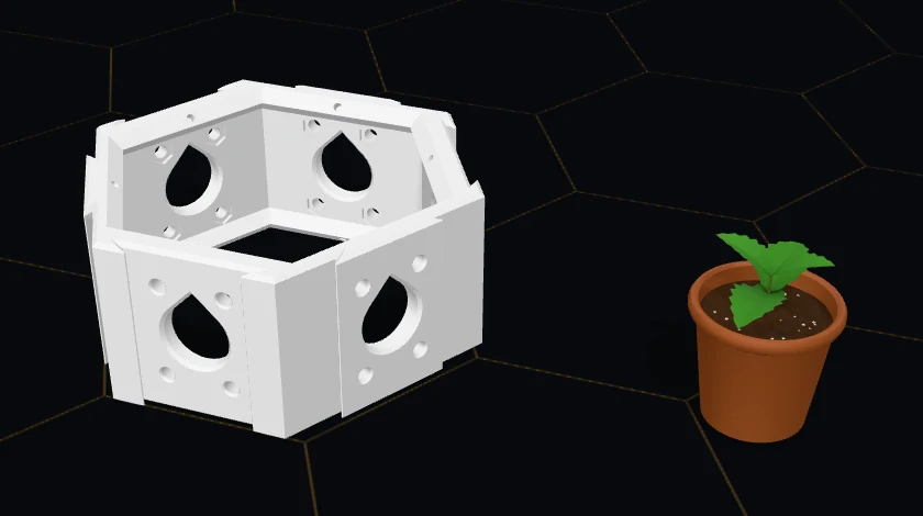 A Hex Cluster base and, beside it on the bench, a small terracotta pot of soil with a mint plant in it